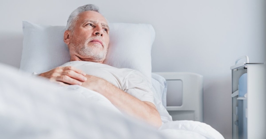 Man in hospital bed thinking about ERISA